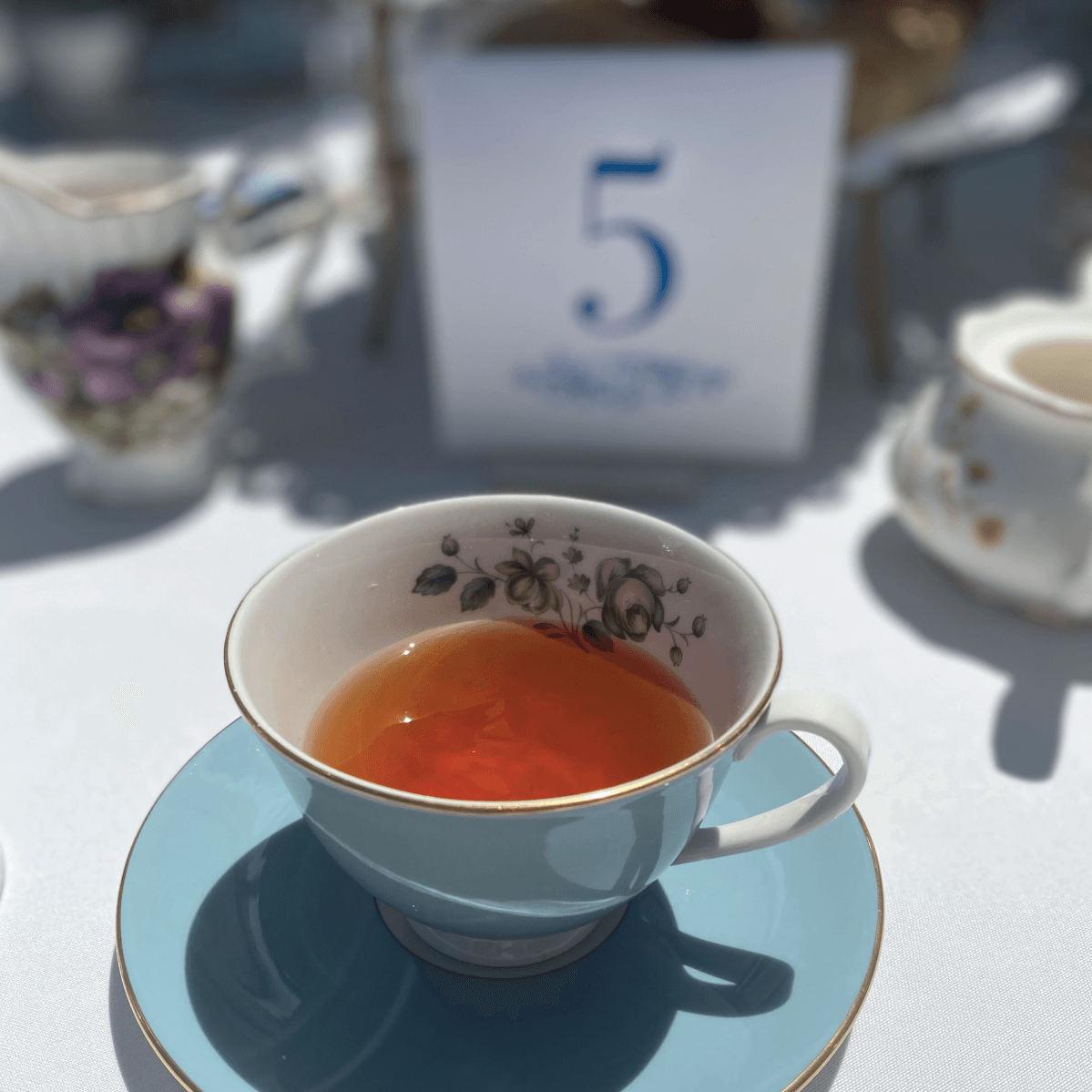 photo of signage and tea cup